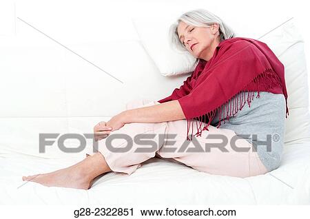 Beautiful mature woman, wrapped in a red shawl, asleep on a sofa View Large Photo Image Stock Image - Beautiful mature woman, wrapped in a red shawl, asleep on a sofa. Fotosearch