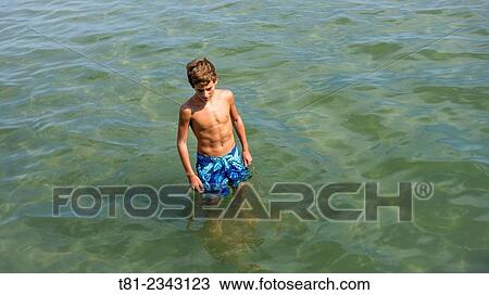 Boy bathing in the sea. Peniscola, Valencian Community, Spain. View Large Photo Image Stock Image - Boy bathing in the sea. Peniscola, Valencian Community, Spain.. Fotosearch