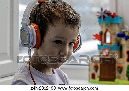 Stock Image - Boy in headphones. Fotosearch