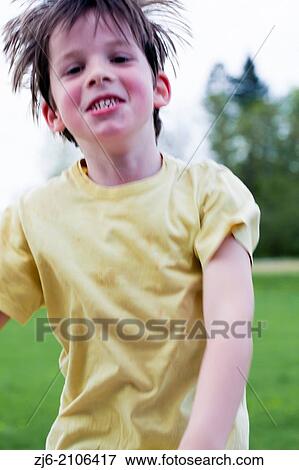 Boy playing outdoors. View Large Photo Image Stock Photo - Boy playing outdoors.. Fotosearch