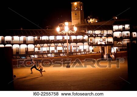 Boys plays soccer in the main square of Chinchon View Large Photo Image Stock Photo - Boys plays soccer in the main square of Chinchon. Fotosearch