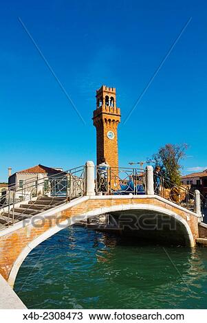 Bridge and clodk tower, Campo Santo Stefano, Murano island, Venice, Italy. View Large Photo Image Stock Image - Bridge and clodk tower, Campo Santo Stefano, Murano island, Venice, Italy.. Fotosearch
