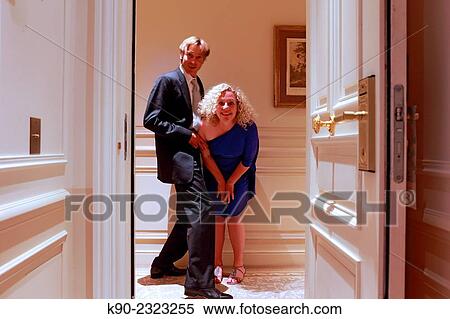 Caucasian man and woman being playful in front of the door of a hotel room, Hotel Hermitage, Monte Carlo, Monaco, Europe. View Large Photo Image Stock Photography - Caucasian man and woman being playful in front of the door of a hotel room, Hotel Hermitage, Monte Carlo, Monaco, Europe.. Fotosearch