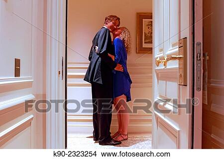 Caucasian man and woman kissing in front of the door of a hotel room, Hotel Hermitage, Monte Carlo, Monaco, Europe. View Large Photo Image Picture - Caucasian man and woman kissing in front of the door of a hotel room, Hotel Hermitage, Monte Carlo, Monaco, Europe.. Fotosearch