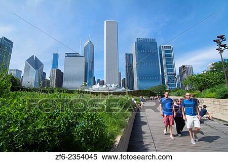 Chicago Illinois Millennium Park in Lurie Gardens with skyline in background skyscrapers in downtown Midwest city and tourists. View Large Photo Image Stock Photography - Chicago Illinois Millennium Park in Lurie Gardens with skyline in background skyscrapers in downtown Midwest city and tourists.. Fotosearch