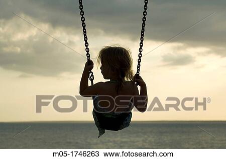 Child playing on a swing in Darwin, Australia View Large Photo Image Stock Image - Child playing on a swing in Darwin, Australia. Fotosearch