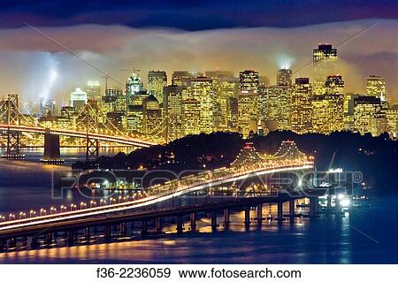 City lights and evening fog in San Francisco and San Francisco Bay, California. View Large Photo Image Stock Photo - City lights and evening fog in San Francisco and San Francisco Bay, California.. Fotosearch