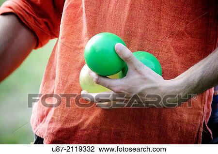 Close up of Male Hand Holding Three Juggling Balls. View Large Photo Image Stock Image - Close up of Male Hand Holding Three Juggling Balls.. Fotosearch