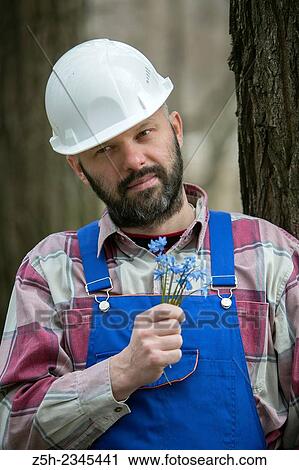 Construction worker with a bouquet of heather. View Large Photo Image Stock Image - Construction worker with a bouquet of heather.. Fotosearch