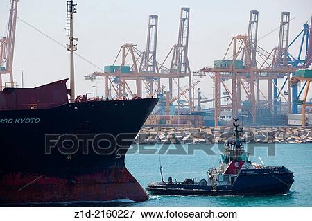 Container ship "MSC KYOTO " entering Valencia harbour Spain with tugs assisting. View Large Photo Image Stock Photo - Container ship "MSC KYOTO " entering Valencia harbour Spain with tugs assisting.. Fotosearch
