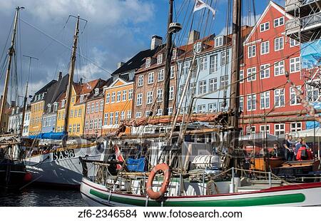 Copenhagen Denmark famous Nyhavn color homes and boats with crowds Kobenhavn tourists. View Large Photo Image Picture - Copenhagen Denmark famous Nyhavn color homes and boats with crowds Kobenhavn tourists.. Fotosearch