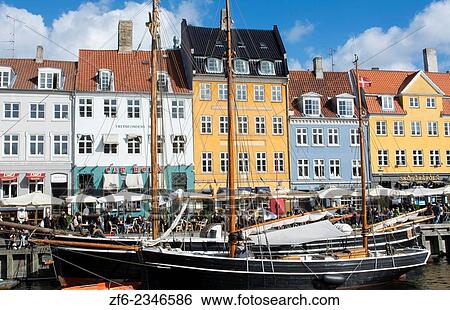 Copenhagen Denmark famous Nyhavn color homes and boats with crowds Kobenhavn tourists. View Large Photo Image Stock Photograph - Copenhagen Denmark famous Nyhavn color homes and boats with crowds Kobenhavn tourists.. Fotosearch