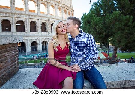 Couple kissing at the Roman Colosseum in Rome Italy. View Large Photo Image Stock Image - Couple kissing at the Roman Colosseum in Rome Italy.. Fotosearch