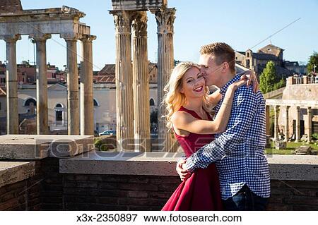 Couple kissing at the Roman Forum by the Temple of Saturn. Rome, Italy. View Large Photo Image Stock Photo - Couple kissing at the Roman Forum by the Temple of Saturn. Rome, Italy.. Fotosearch