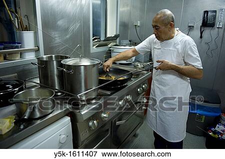 During the voyage of the MV Flintercape from Rotterdam, Netherlands to Sundsvall, Sweden, this Indonesian cook takes care of all the food and meals on board. View Large Photo Image Stock Photo - During the voyage of the MV Flintercape from Rotterdam, Netherlands to Sundsvall, Sweden, this Indonesian cook takes care of all the food and meals on board.. Fotosearch