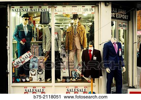 Stock Image - Facade of a menswear shop in Petticoat Lane, London, England, UK, Europe.. Fotosearch