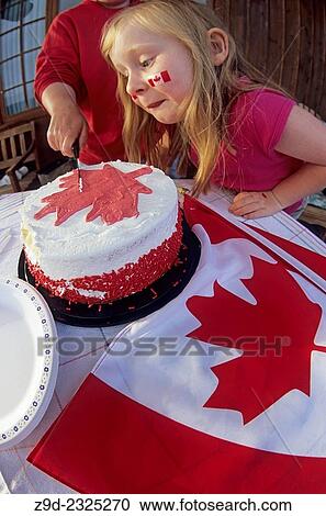 Family celebrating Canada Day holiday with cake and flags. View Large Photo Image Stock Image - Family celebrating Canada Day holiday with cake and flags.. Fotosearch