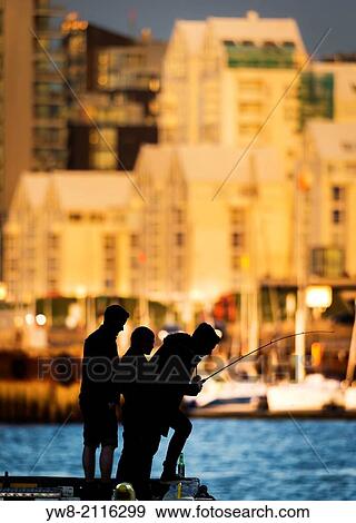 Stock Photo - Fishing off a pier, Reykjavik, Iceland.. Fotosearch