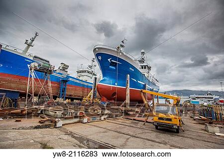 Stock Image - Fishing trawlers in dry dock, Reykjavik Harbor, Reykjavik, Iceland.. Fotosearch