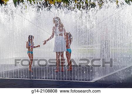 Florida, Miami Beach, Art Basel, Art Public, Collins Park, fountain, water, woman, mother, girl, daughter. View Large Photo Image Stock Photo - Florida, Miami Beach, Art Basel, Art Public, Collins Park, fountain, water, woman, mother, girl, daughter.. Fotosearch