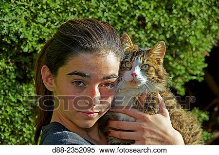 France, Alpes-Maritimes, Mandelieu la Napoule, Carla with a domestic cat. View Large Photo Image Stock Photography - France, Alpes-Maritimes, Mandelieu la Napoule, Carla with a domestic cat.. Fotosearch