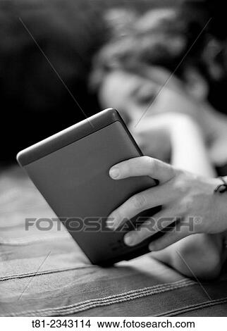 girl reading an eBook, studying, Valencia, Spain View Large Photo Image Picture - girl reading an eBook, studying, Valencia, Spain. Fotosearch