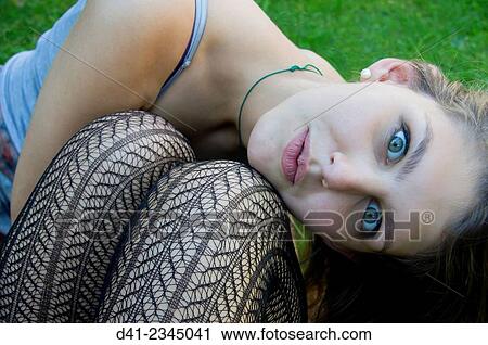 Stock Image - Girl teenager portrait wide eyed.. Fotosearch