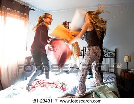 girls doing pillow fight, Valencia View Large Photo Image Stock Photo - girls doing pillow fight, Valencia. Fotosearch