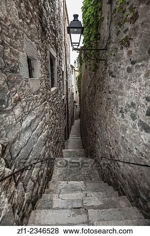 Girona, Catalonia, Spain. Narrow street in old town. View Large Photo Image Stock Photo - Girona, Catalonia, Spain. Narrow street in old town.. Fotosearch