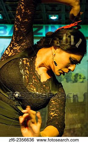 Stock Photograph - Granada Spain traditional Flamenco dancer with musioc in Tablao Albayzin Restaurant and costumes.. Fotosearch