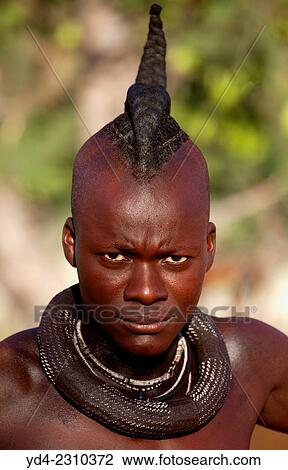 Stock Image - Himba man with the typical necklace, Kaokoland, Namibia.. Fotosearch