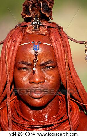 Himba woman with the typical ornaments, near to Epupa Falls, Kaokoland, Namibia. View Large Photo Image Picture - Himba woman with the typical ornaments, near to Epupa Falls, Kaokoland, Namibia.. Fotosearch