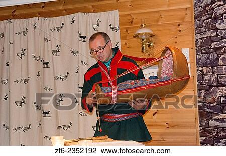 Honningsvag Norway cruise Hurtigruten Sami leader discussing Sami life and baby bed to tourists in Northern most place in Europe MR-26. View Large Photo Image Stock Image - Honningsvag Norway cruise Hurtigruten Sami leader discussing Sami life and baby bed to tourists in Northern most place in Europe MR-26.. Fotosearch