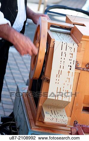 Stock Image - Italy, Lombardy, Organ Grinder with Barrel Organ.. Fotosearch