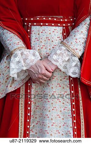 Stock Photo - Italy, Piedmont, Historical Reenactment Mediaeval,, Woman in Medieval Costume, Hands.. Fotosearch