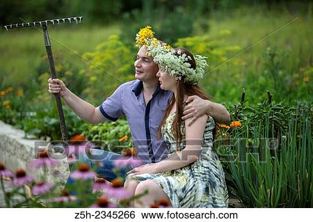 Lovers with wreaths on their heads retired in the park. View Large Photo Image Stock Photograph - Lovers with wreaths on their heads retired in the park.. Fotosearch