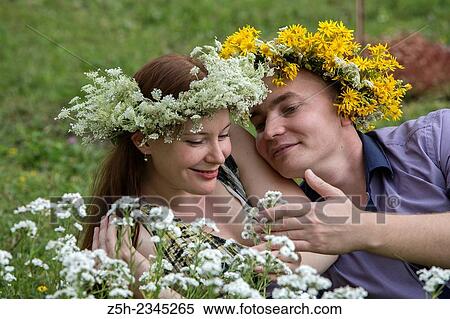 Lovers with wreaths on their heads retired in the park. View Large Photo Image Stock Photography - Lovers with wreaths on their heads retired in the park.. Fotosearch