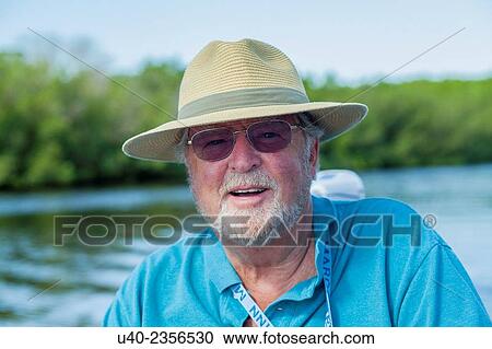 Man in boat. View Large Photo Image Stock Image - Man in boat.. Fotosearch