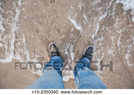 Man's feet in the water at a beach. View Large Photo Image Stock Image - Man's feet in the water at a beach.. Fotosearch