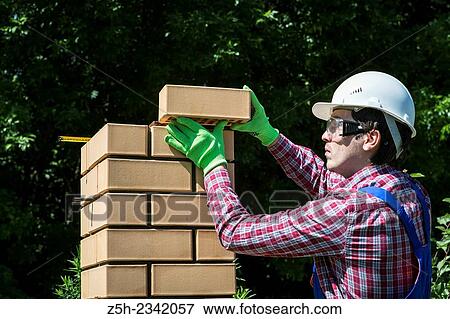 Stock Photo - Mason is brickwork.. Fotosearch