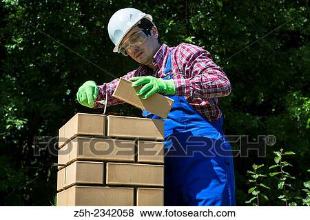 Stock Photo - Mason is brickwork.. Fotosearch