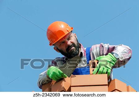 Stock Photo - Mason is brickwork.. Fotosearch
