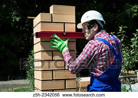 Stock Photograph - Mason is brickwork.. Fotosearch