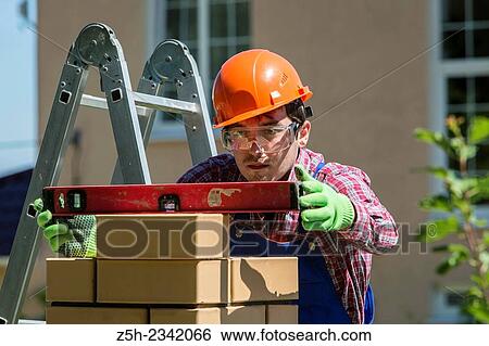 Mason is brickwork. View Large Photo Image Stock Photograph - Mason is brickwork.. Fotosearch