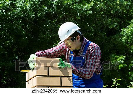 Stock Photography - Mason is brickwork.. Fotosearch