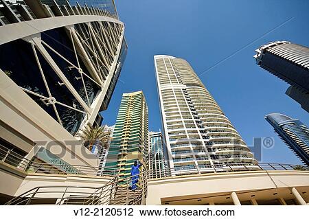 Modern high-rise apartment towers at Jumeirah Lakes Towers JLT at Dubai, UAE. View Large Photo Image Stock Image - Modern high-rise apartment towers at Jumeirah Lakes Towers JLT at Dubai, UAE.. Fotosearch