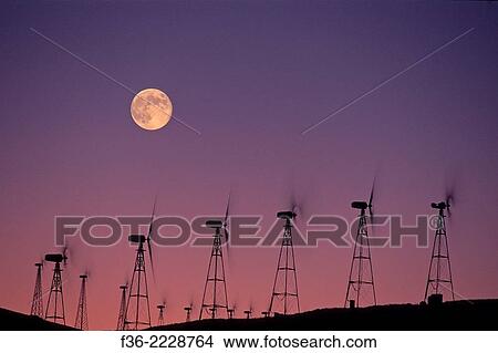Picture - Moon over wind turbine clean energy windmills, Altamont Pass, Alameda County, California.. Fotosearch