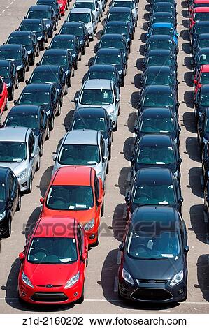 New cars being unloaded and parked on quayside of the port of Valencia Spain. View Large Photo Image Stock Image - New cars being unloaded and parked on quayside of the port of Valencia Spain.. Fotosearch