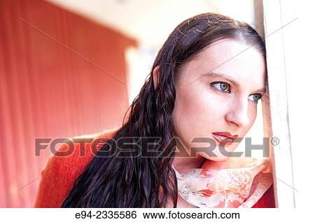 Portrait of a 33 year old brunette woman looking away from the camera, outdoors. View Large Photo Image Stock Photograph - Portrait of a 33 year old brunette woman looking away from the camera, outdoors.. Fotosearch