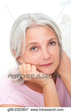 portrait of a beautiful mature woman, sad or thoughtful, in pink View Large Photo Image Stock Photo - portrait of a beautiful mature woman, sad or thoughtful, in pink. Fotosearch
